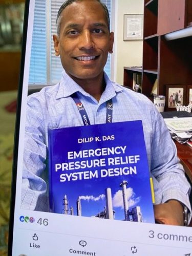 Dr. Shamik Das holding my book